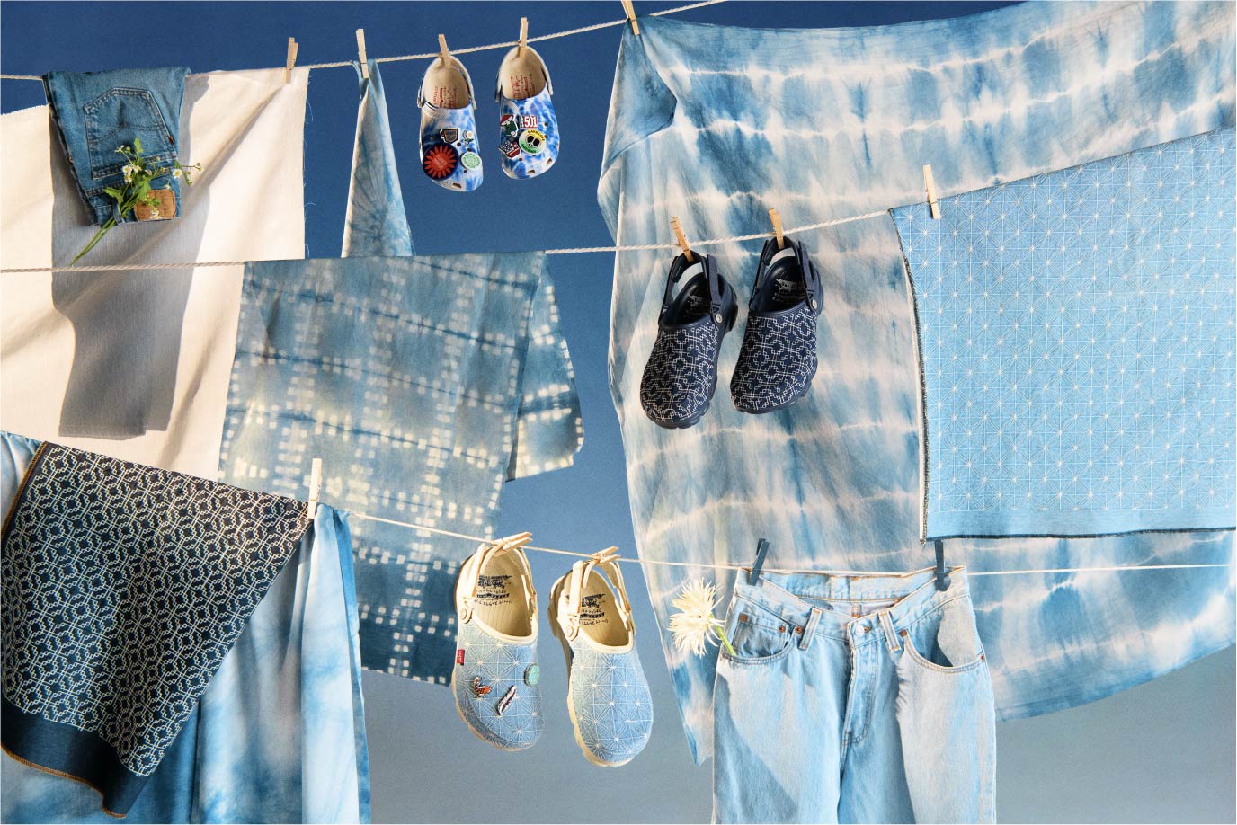 Three pairs of Levi's x CROCS shoes were hanging on the clothesline - Levi's Hong Kong